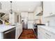 Modern kitchen showcasing stainless steel appliances, white cabinets, and a convenient island with a sink at 5032 N Illinois St, Indianapolis, IN 46208