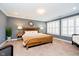 Bedroom with wood bed frame, carpet and stylish decorations at 5032 N Illinois St, Indianapolis, IN 46208
