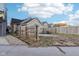Side view of a spacious backyard with a fire pit area and privacy fence at 546 E Merrill St, Indianapolis, IN 46203