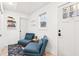 Bright hallway features seating, stylish decorations and a 