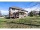 Expansive backyard with a patio, lush green grass, and mature trees, ideal for outdoor activities and entertaining at 5517 Westbourne Ct, Greenwood, IN 46143
