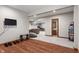 Open finished basement layout with a living area, exercise space, and a convenient bathroom at 5517 Westbourne Ct, Greenwood, IN 46143