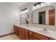 Bathroom featuring a double vanity with marble countertops and two mirrors at 5517 Westbourne Ct, Greenwood, IN 46143
