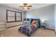 Bright bedroom with natural light, carpeted floors and an inviting bed at 5517 Westbourne Ct, Greenwood, IN 46143