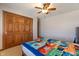 Comfortable carpeted bedroom with a double door closet and colorful bed at 5517 Westbourne Ct, Greenwood, IN 46143