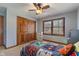Carpeted bedroom with natural light, closet, and inviting bed at 5517 Westbourne Ct, Greenwood, IN 46143