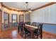 Formal dining room featuring chair railing, hardwood floors, and ample natural light at 5517 Westbourne Ct, Greenwood, IN 46143