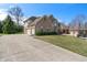 Stunning brick home with attached garage and spacious driveway offering curb appeal at 5517 Westbourne Ct, Greenwood, IN 46143