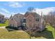 Beautiful two-story brick home with mature trees and a well-maintained front lawn at 5517 Westbourne Ct, Greenwood, IN 46143