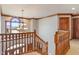 Spacious foyer featuring a chandelier and a beautiful staircase with wooden banister at 5517 Westbourne Ct, Greenwood, IN 46143