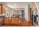 Bright kitchen features wooden cabinets, granite countertops, and stainless steel appliances at 5517 Westbourne Ct, Greenwood, IN 46143