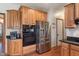 Modern kitchen with stainless steel appliances, granite countertops, and ample cabinet space at 5517 Westbourne Ct, Greenwood, IN 46143