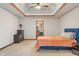 Serene bedroom features tray ceiling and adjoins a private bathroom at 5517 Westbourne Ct, Greenwood, IN 46143