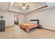 Inviting main bedroom with a tray ceiling and an en-suite bathroom at 5517 Westbourne Ct, Greenwood, IN 46143