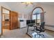Bright office space with vaulted ceiling, two monitors and built-in desk at 5517 Westbourne Ct, Greenwood, IN 46143