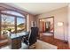 Bright home office featuring a large window, wood floors, and stylish decor at 5517 Westbourne Ct, Greenwood, IN 46143