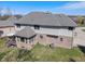 Spacious two-story home with brick and siding exterior, a cozy sunroom, and lush backyard at 5517 Westbourne Ct, Greenwood, IN 46143