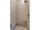 Walk-in shower featuring beige tile, bronze trim, and built-in shower head at 5517 Westbourne Ct, Greenwood, IN 46143