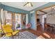 Comfortable sunroom with a cozy chair, natural light, and a door to the back patio at 5517 Westbourne Ct, Greenwood, IN 46143