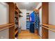 Walk-in closet with wood shelving and wood floor at 5517 Westbourne Ct, Greenwood, IN 46143