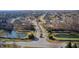 Stunning aerial captures quiet neighborhood entrance with picturesque ponds and manicured landscaping at 5842 Oakmont Blvd, Bargersville, IN 46106