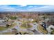 Aerial showcases peaceful neighborhood with meticulously landscaped circle drive and mature trees at 5842 Oakmont Blvd, Bargersville, IN 46106