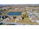 Beautiful aerial view of a suburban neighborhood featuring a pond and well-maintained lawns at 5842 Oakmont Blvd, Bargersville, IN 46106