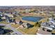Aerial view of homes with ponds and expansive yards, showcasing a blend of luxury and nature at 5842 Oakmont Blvd, Bargersville, IN 46106