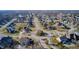 Panoramic aerial highlights the neighborhood's harmonious layout, featuring inviting circle drive and mature trees at 5842 Oakmont Blvd, Bargersville, IN 46106