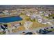 Scenic aerial shot showcases homes near a serene pond in a neatly planned community on a sunny day at 5842 Oakmont Blvd, Bargersville, IN 46106