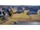 Spacious, well-manicured backyard featuring a playground set, bordered by a dark fence, offering a great space at 5842 Oakmont Blvd, Bargersville, IN 46106