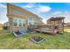 Spacious backyard with a deck and gazebo, perfect for outdoor entertaining and gardening at 5842 Oakmont Blvd, Bargersville, IN 46106