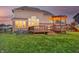 Expansive backyard view featuring a spacious wooden deck, pergola, and bright, sunlit windows at 5842 Oakmont Blvd, Bargersville, IN 46106