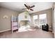 Playful bedroom with a house-shaped bunk bed, ceiling fan, and bright windows, perfect for creativity and rest at 5842 Oakmont Blvd, Bargersville, IN 46106