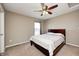 Cozy bedroom features neutral walls, a ceiling fan, and carpet flooring for a comfortable living space at 5842 Oakmont Blvd, Bargersville, IN 46106