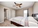 Spacious bedroom with a ceiling fan, ensuite bathroom and ample natural light provides a comfortable and private retreat at 5842 Oakmont Blvd, Bargersville, IN 46106