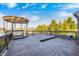 Enjoy outdoor living on this deck, complete with gazebo and views of the surrounding landscape at 5842 Oakmont Blvd, Bargersville, IN 46106