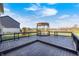 Spacious deck features a gazebo, overlooking a lush backyard and scenic views at 5842 Oakmont Blvd, Bargersville, IN 46106