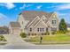 Attractive brick home with a two-car garage, driveway, and a lush green lawn at 5842 Oakmont Blvd, Bargersville, IN 46106