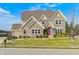 Attractive brick home featuring a manicured lawn and inviting curb appeal at 5842 Oakmont Blvd, Bargersville, IN 46106