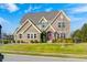 Beautiful two-story home featuring a well-manicured lawn and appealing architectural details at 5842 Oakmont Blvd, Bargersville, IN 46106