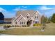 Charming two-story brick home with well-manicured lawn and professional landscaping at 5842 Oakmont Blvd, Bargersville, IN 46106