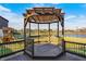 Relax in the gazebo on the deck, overlooking the backyard and scenic pond at 5842 Oakmont Blvd, Bargersville, IN 46106