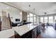 Open floor plan showcasing the kitchen with a granite island and modern appliances at 5842 Oakmont Blvd, Bargersville, IN 46106