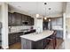 Beautiful kitchen with granite counters, dark cabinets and stainless steel appliances at 5842 Oakmont Blvd, Bargersville, IN 46106
