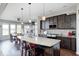 Kitchen with granite island, stainless appliances, and open flow to dining area at 5842 Oakmont Blvd, Bargersville, IN 46106