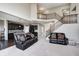 Living room showcasing open layout connecting to the kitchen and staircase at 5842 Oakmont Blvd, Bargersville, IN 46106