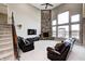 Open-concept living room featuring a stone fireplace, high ceilings, and natural light at 5842 Oakmont Blvd, Bargersville, IN 46106