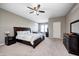 Spacious main bedroom features a ceiling fan and comfortable seating area at 5842 Oakmont Blvd, Bargersville, IN 46106