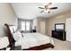 Inviting main bedroom with carpeted floors, ceiling fan and lots of natural light at 5842 Oakmont Blvd, Bargersville, IN 46106